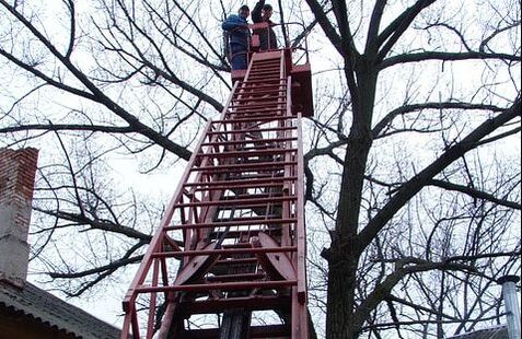emergency workers climbing later after a storm